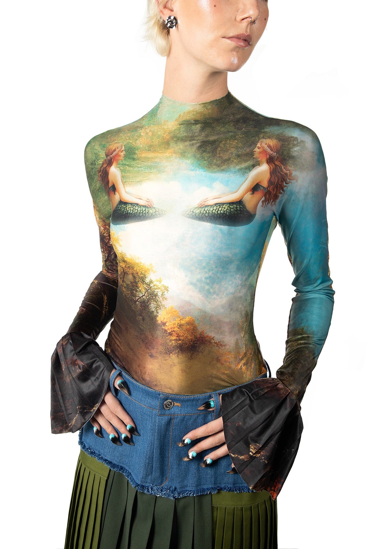 A woman wearing a long-sleeve top with a classical painting design on a white background