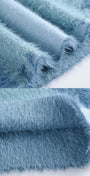 Close-up of textured blue fabric with a soft, plush surface