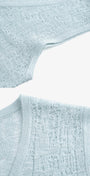 light blue knit top detail